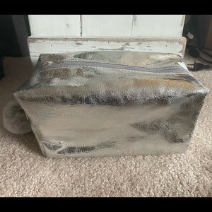 NWOT Silver Metallic Large Cosmetic Bag with Pom Zipper